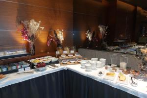 a table with food on it in a restaurant at Splendid Etoile in Paris
