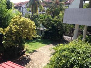an overhead view of a garden with a bench and trees at Vegan Stay by The Vegan Kitchen by Sulo in Boralesgamuwa