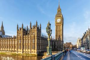 a large building with a clock tower and big ben at Two Bedroom Flat Central London in London