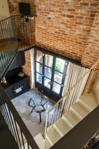 an overhead view of a room with a brick wall at Palazzo Fauzone Relais in Mondovì