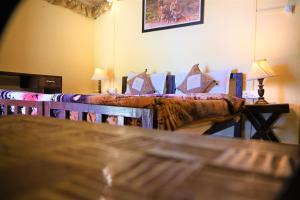 Ένα ή περισσότερα κρεβάτια σε δωμάτιο στο Shikaar Valley +23 φωτογραφίες