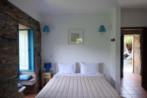 Postel nebo postele na pokoji v ubytování Casa do Engenho - Canadelo Amarante