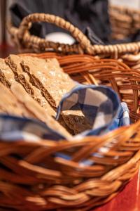 a basket filled with bread on top of a table at Hotel Kupolen in Borlänge +34 photos