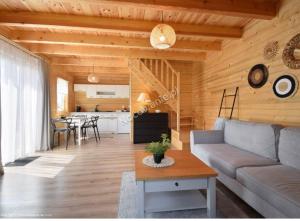 a living room with a couch and a table at Amara Houses in Rewal