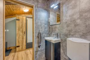 a bathroom with a sink and a toilet at Holiday Home Carpe Diem in Jastrebarsko