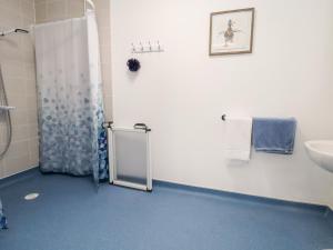 a bathroom with a shower and a sink at 91 Main Street in Frodsham +24 photos
