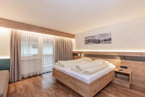 Postel nebo postele na pokoji v ubytování Haus Manfred