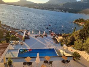 a view of a body of water with a swimming pool at Agape Rose Hotel in Tivat