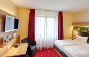 Postel nebo postele na pokoji v ubytování Akzent Aktiv & Vital Hotel Thüringen