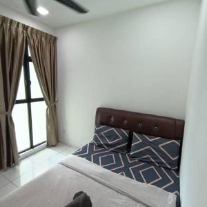 a bedroom with a bed and a large window at Cozy Sky Loft 5 Guests with Netflix & Facilities L28 in Johor Bahru
