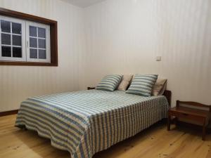 מיטה או מיטות בחדר ב-Pousadinha de Paradela