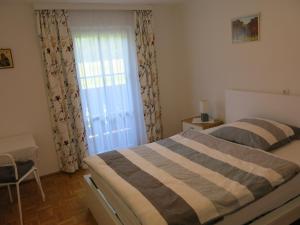 Postel nebo postele na pokoji v ubytování Ferienwohnung Marterer + 5 fotografií