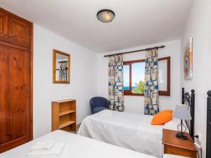 A bed or beds in a room at Great Son Bou Villa Casa Lucia 3 Bedroom Family Villa Large Spacious Pool Area Sea Views