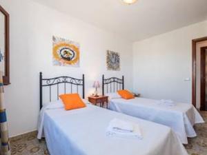 A bed or beds in a room at Great Son Bou Villa Casa Lucia 3 Bedroom Family Villa Large Spacious Pool Area Sea Views