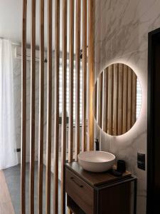a bathroom with a sink and a mirror at Number 21 by DBI in Kyiv