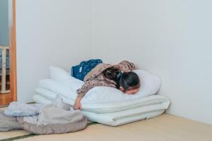 Postel nebo postele na pokoji v ubytování Global Resort Misen - グローバルリゾート弥山