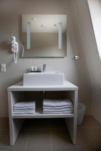 Phòng tắm tại Hotel Zeerust Texel