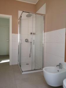 a bathroom with a shower and a sink at Maresol apartment in Carrara