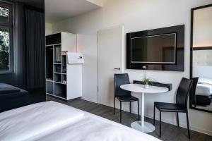 Postel nebo postele na pokoji v ubytování INNSiDE by Meliá Leipzig