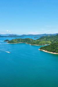 an aerial view of a large body of water with islands at Hyatt Regency Shenzhen Yantian in Shenzhen