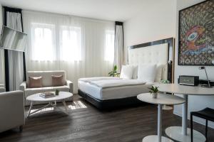 Postel nebo postele na pokoji v ubytování INNSiDE by Meliá Leipzig