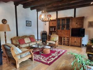 a living room with a couch and a table at Casa Rural Goikitxe Etxea in Goizueta