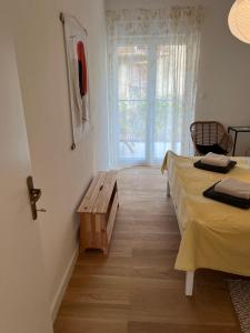 a room with two beds and a window at Sea View Apartment in Jelsa