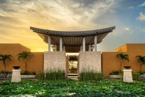 a renderización de un edificio con palmeras en Banyan Tree Mayakoba, en Playa del Carmen