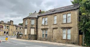 an old brick building on the side of a street at Spacious ground floor suite comfortably sleeps up to eight in Halifax