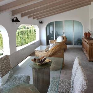 a living room with two chairs and a table at Apartments in a "VILLA VISTA JAVEA" in Jávea