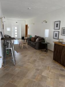 a living room with a couch and a table at Moinhos do Guadiana in Pedrógão