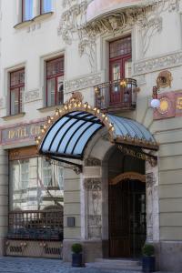 a building with an awning and lights on it at K+K Hotel Central in Prague