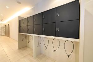 a row of lockers in a hospital hallway at Richmond Hotel Yokohama-Bashamichi in Yokohama