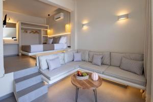 a living room with a couch and a table at Pearl Suites and Villa Tinos in Tinos Town