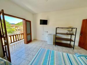 Una cama o camas en una habitación de Pousada Recanto da Traineira