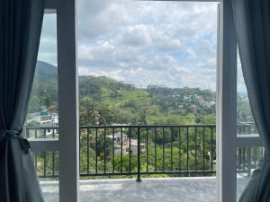 a window with a view of a mountain at Golden sky in Kandy