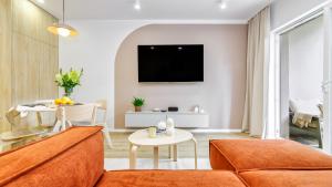 a living room with a couch and a table at InTheMiddle in Ostróda