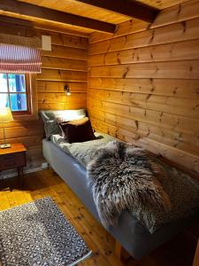 En eller flere senger på et rom på Large and cosy mountain cabin