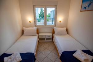 Posteľ alebo postele v izbe v ubytovaní VILLA OLEA - ŠIBENIK