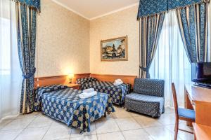 TV a/nebo společenská místnost v ubytování Hotel Orlanda