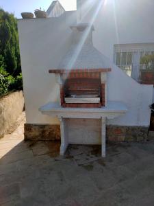a stone oven sitting on top of a stairs at Apartments in a "VILLA VISTA JAVEA" in Jávea