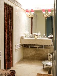 a bathroom with a sink and a mirror at 3BR Venetian-style Villa in Mytilene City Centre in Mytilini