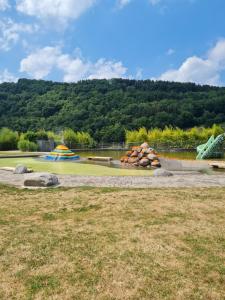 a water park with a water slide and a playground at Ferienwohnung am Rursee in Simmerath