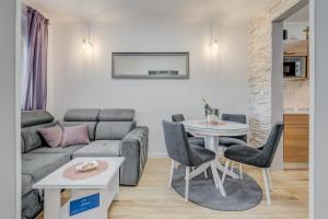 a living room with a couch and a table at Da Da in Kaštela