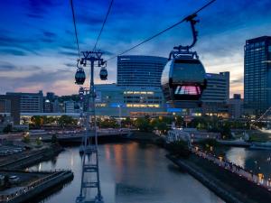 a gondola ride over a river in a city at Richmond Hotel Yokohama-Bashamichi in Yokohama