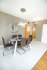 a dining room with a table and chairs at Paulay free parking design 51 apartman with terazze in Budapest