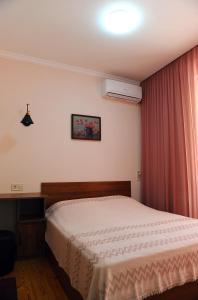 Postel nebo postele na pokoji v ubytování Janika apartments