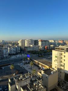 an aerial view of a city with a parking lot at Vintage Sea-View Apartment in Centre Durres in Durrës