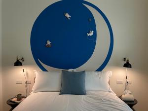 Postel nebo postele na pokoji v ubytování 月月寓室 Luna INN 民宿