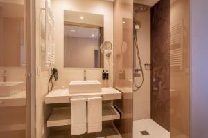 a bathroom with a sink and a shower at Eurostars Oasis Marbella in Marbella